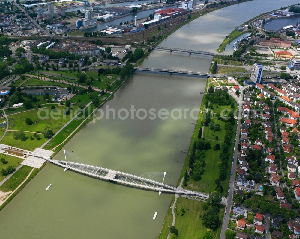 Kehl from above - The bridge Passerelle des Deux Rives over the Rhine in Kehl in the state of Baden-Württemberg. It is a pedestrian and cycling bridge connecting the German side Kehl and the french city of Strasbourg. It was opened during the garden fair in 2004. The two runways meet on a platform in its center