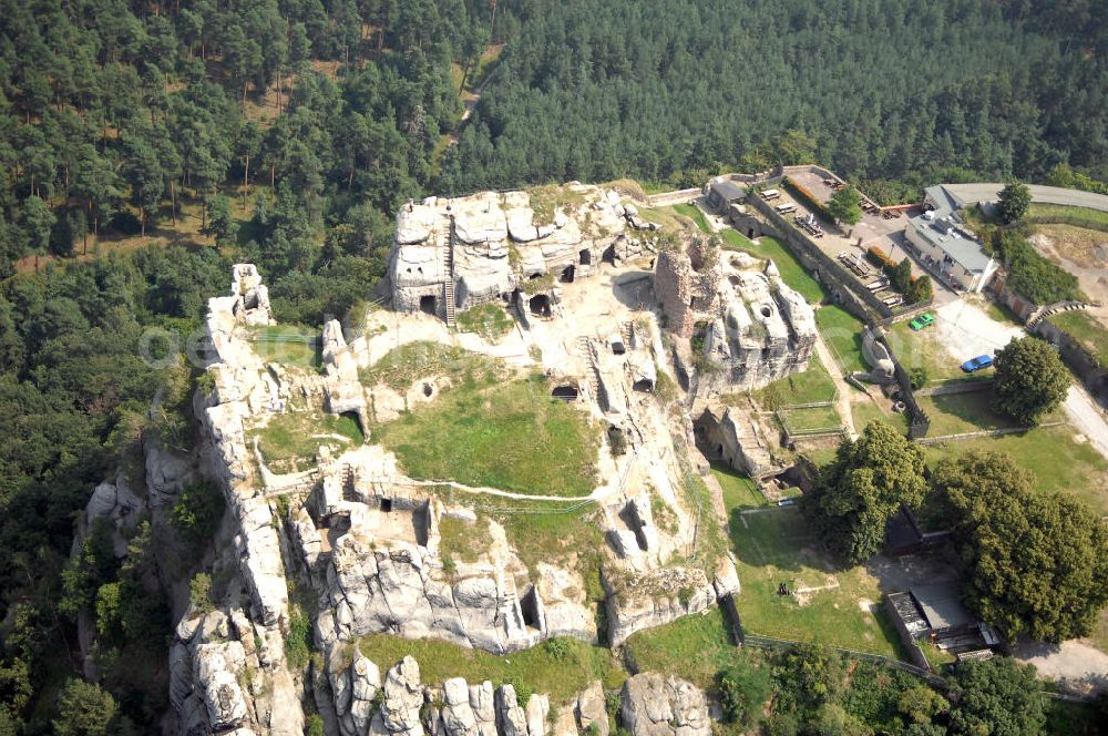 Aerial image Blankenburg - Die Burgruine Regenstein liegt 3 km nördlich von Blankenburg in Sachsen-Anhalt und ist ein beliebtes Ausflugszie. Charakteristisch sind die vielen in den natürlichen Fels getriebenen höhlenartigen Räumlichkeiten (in einem befindet sich heute eine Ausstellung von Bodenfunden aus dem Burgbereich). Zu erkennen ist auch die Ruine des Bergfrieds.