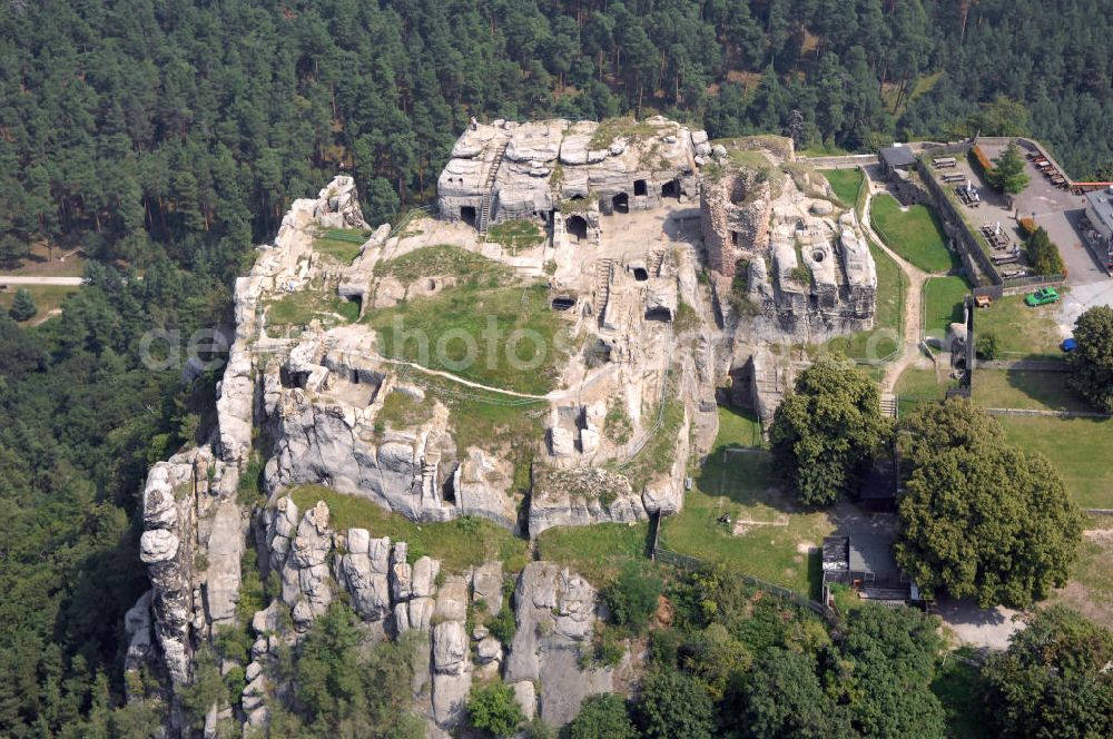 Aerial photograph Blankenburg - Die Burgruine Regenstein liegt 3 km nördlich von Blankenburg in Sachsen-Anhalt und ist ein beliebtes Ausflugszie. Charakteristisch sind die vielen in den natürlichen Fels getriebenen höhlenartigen Räumlichkeiten (in einem befindet sich heute eine Ausstellung von Bodenfunden aus dem Burgbereich). Zu erkennen ist auch die Ruine des Bergfrieds.