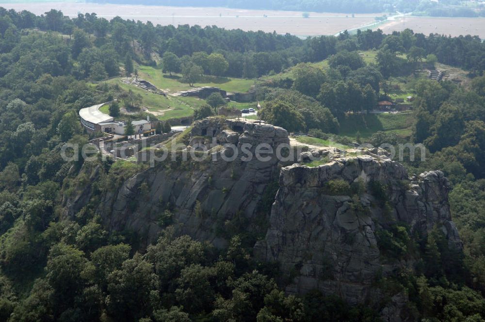 Aerial image Blankenburg - Die Burgruine Regenstein liegt 3 km nördlich von Blankenburg in Sachsen-Anhalt und ist ein beliebtes Ausflugsziel, auf dem jedes Jahr ein Ritterspiel und ein Garnisonsfest stattfinden. Hervorzuheben sind einige in den Fels hineingehauene Räume und die Ruine des Bergfrieds.