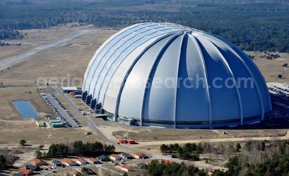 Halbe from the bird's eye view: Die ehemalige Cargolifterhalle und größte freitragende Halle (Aerium) der Welt auf dem Gelände des ehemaligen Militärflugplatzes in Halbe-Brand. Heute befindet sich in der Halle das Tropical Islands, die größte tropische Freizeitwelt Europas. The former Cargolift Hall on the area of the former military airport in Halbe-Brand.