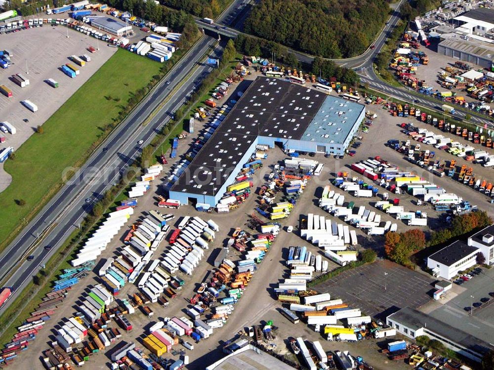 Aerial photograph Sittensen - 18.10.2005 Sittensen; Die Firma Alga betreibt seit über 30 Jahren in Sittensen an der A1 einen Nutzfahrzeughandel, auf ca. 400.000 m² Lagerfläche werden mehr als 3000 Einheiten vorgehalten. Ergänzt wird die Angebotspalette durch einen Reifengroßhandel und Service, durch Werkstatt, Lackiererei und Ersatzteillager.