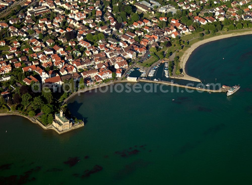 Langenargen from above - The borough of Langenargen on Lake Constance in the state of Baden-Wuerttemberg. The borough is located on the Northern shore of the lake on a broad headland. Castle Monfort is visible apart from the residential buildings and the town centre. The castle is Langenargen's landmark and was built in the 1860s. Its architecture is influenced orientally