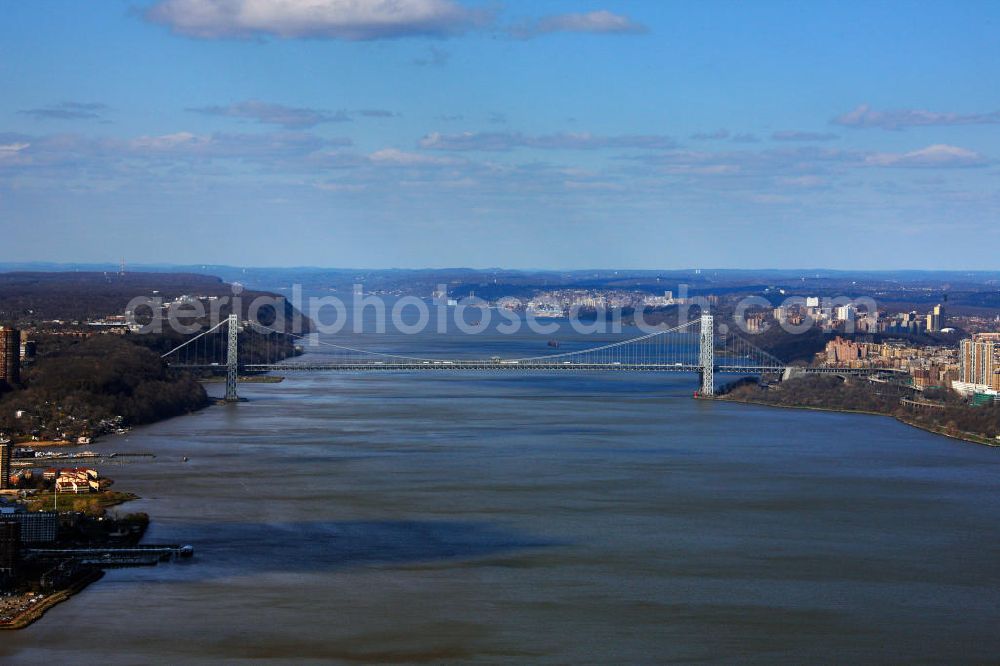 Aerial photograph New York - View of the George Washington bridge over the Hudson River. It connects the island of Manhattan with New Jersey. The construction began in September 1927 under the guidance of Othmar Ammann. The construction work was completed in October 1931. Lanes are located on two levels of the bridge