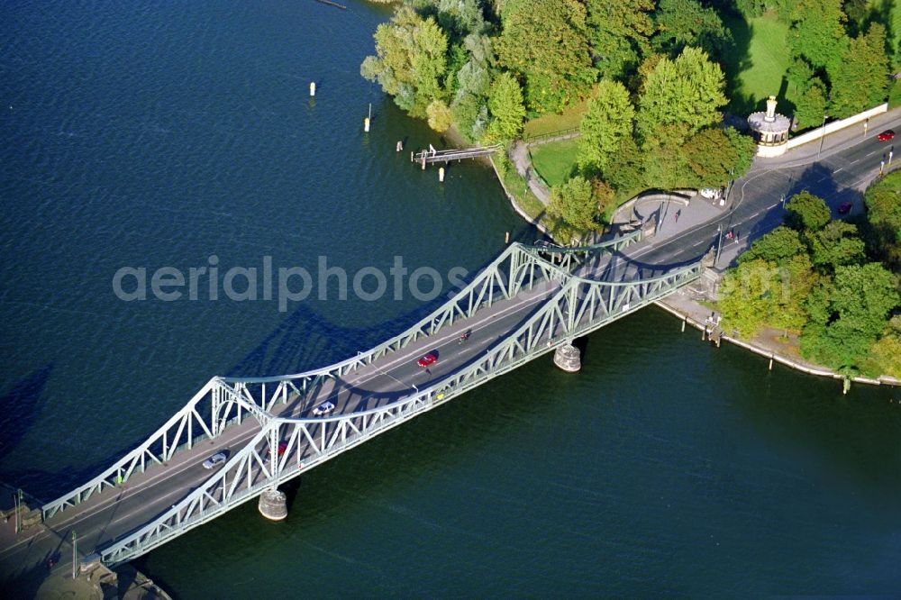 Potsdam from the bird's eye view: The Glienicker Bridge in Potsdam in the state of Brandenburg. The bridge connects the Wannsee part of Berlin with the district Berliner Vorstadt of Potsdam across the river Havel. The frame bridge became famous during the Cold War under the nickname Bridge of Spies due to several deals and exchanges of people between West and East Germany and the powers of the Cold War