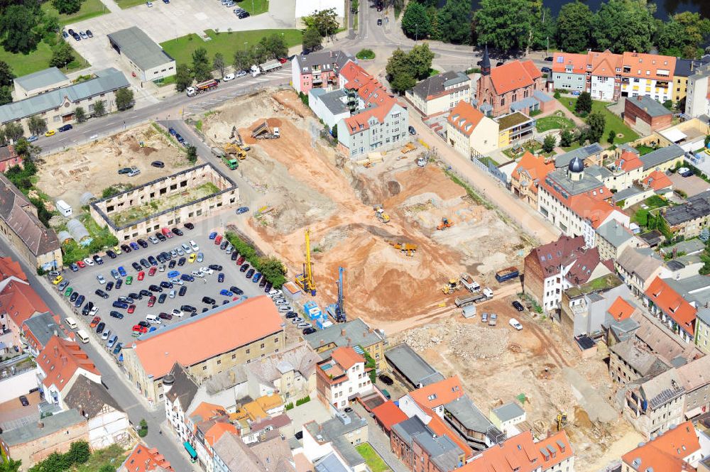 Aerial photograph Wittenberg - View of the construction site of the shopping center Arsenal between the Arsenal square and the market place in the inner city of Wittenberg. Project developers are MIB AG and the OFB Development GmbH. The completion is scheduled for autumn 2012