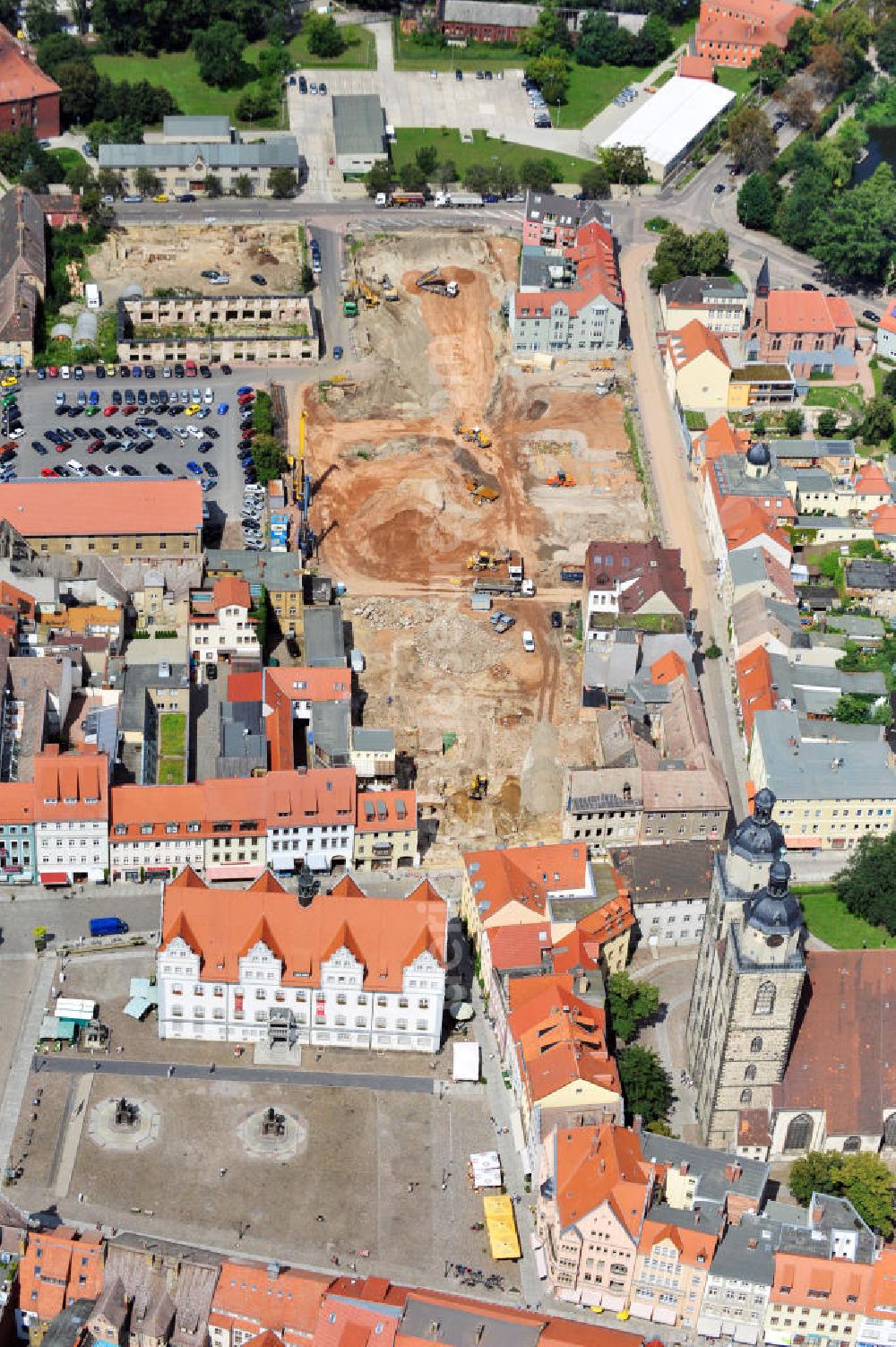 Wittenberg from the bird's eye view: View of the construction site of the shopping center Arsenal between the Arsenal square and the market place in the inner city of Wittenberg. Project developers are MIB AG and the OFB Development GmbH. The completion is scheduled for autumn 2012