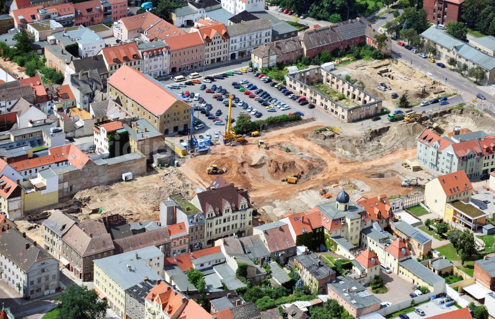 Aerial photograph Wittenberg - View of the construction site of the shopping center Arsenal between the Arsenal square and the market place in the inner city of Wittenberg. Project developers are MIB AG and the OFB Development GmbH. The completion is scheduled for autumn 2012