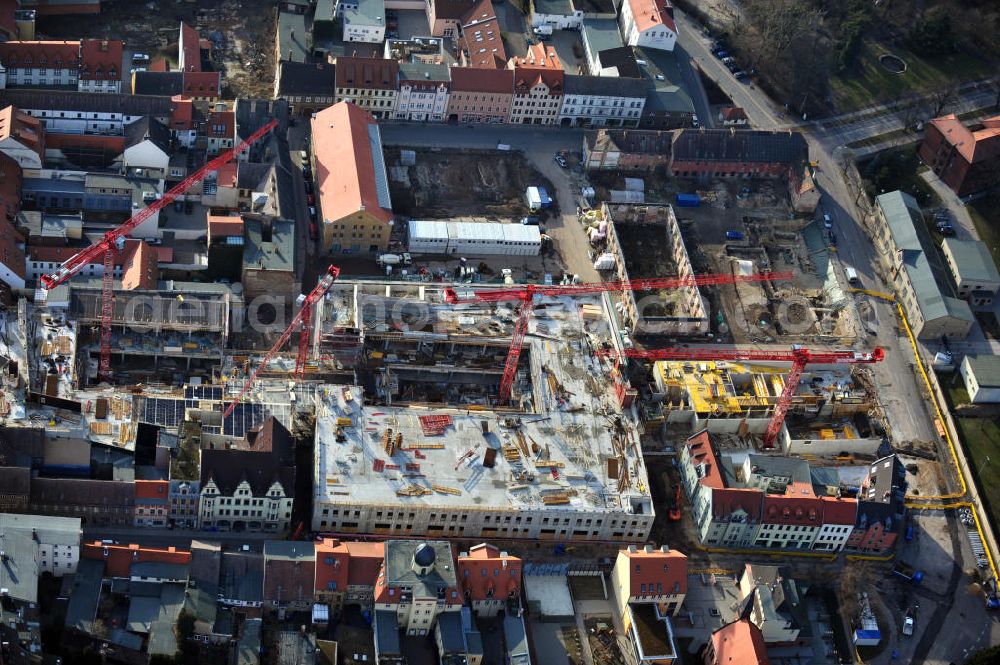 Aerial photograph Wittenberg - View of the construction site of the shopping center Arsenal between the Arsenal square and the market place in the inner city of Wittenberg. Project developers are MIB AG and the OFB Development GmbH. The completion is scheduled for autumn 2012