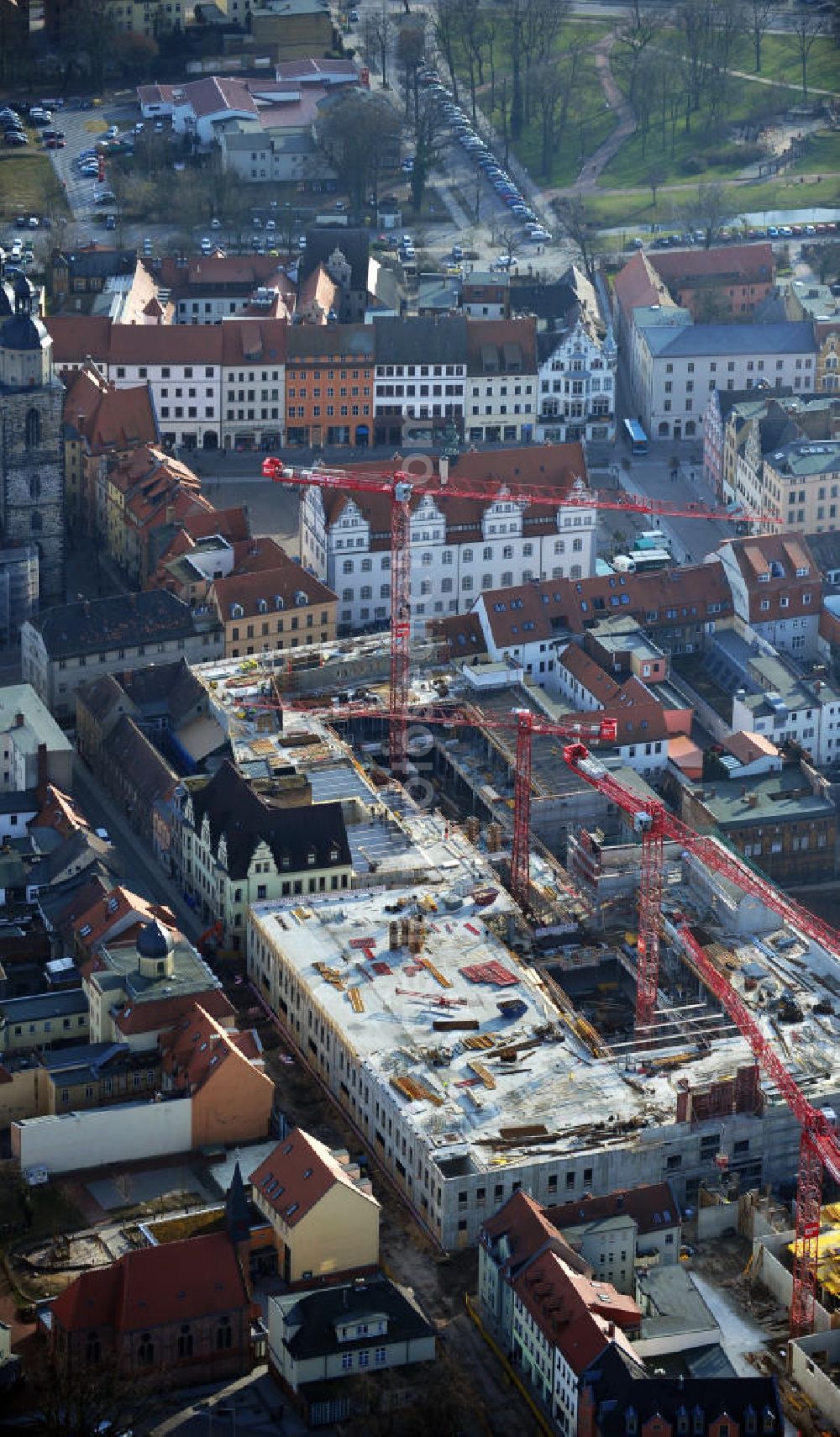 Wittenberg from the bird's eye view: View of the construction site of the shopping center Arsenal between the Arsenal square and the market place in the inner city of Wittenberg. Project developers are MIB AG and the OFB Development GmbH. The completion is scheduled for autumn 2012