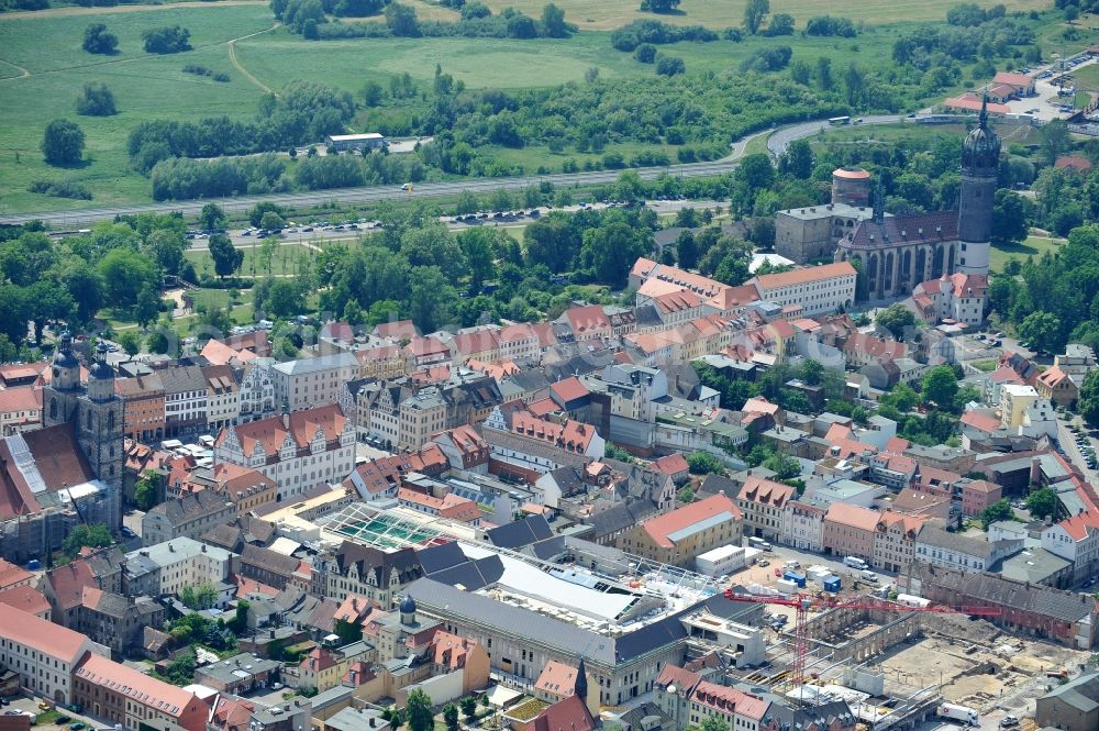 Wittenberg from the bird's eye view: View of the construction site of the shopping center Arsenal between the Arsenal square and the market place in the inner city of Wittenberg. Project developers are MIB AG and the OFB Development GmbH. The completion is scheduled for autumn 2012