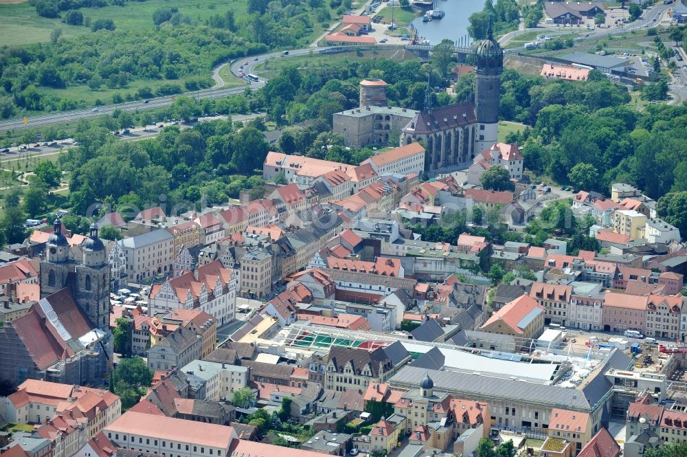 Aerial photograph Wittenberg - View of the construction site of the shopping center Arsenal between the Arsenal square and the market place in the inner city of Wittenberg. Project developers are MIB AG and the OFB Development GmbH. The completion is scheduled for autumn 2012