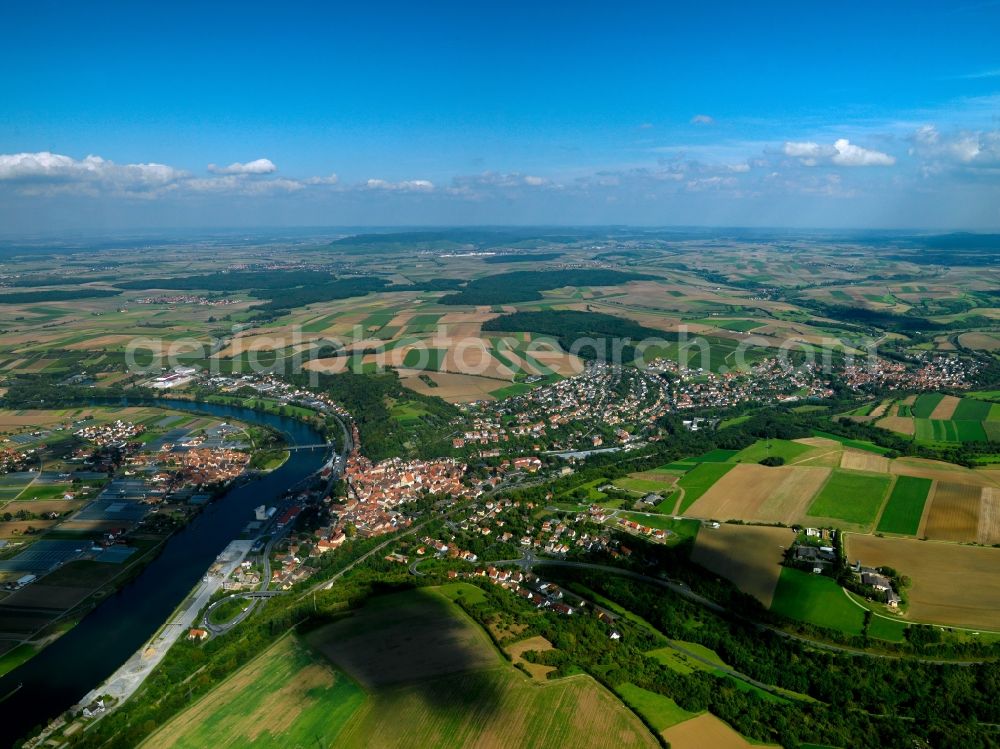 Aerial image Kitzingen - The large district capital of Kitzingen in the Mainfranken region in the state of Bavaria. The surrounding landscape of the town is characterised by agriculture and fields. It is located on both sides of the river Main, which is crossed by several bridges. The historic city center and the industrial and commercial area of the town are located on its eastside