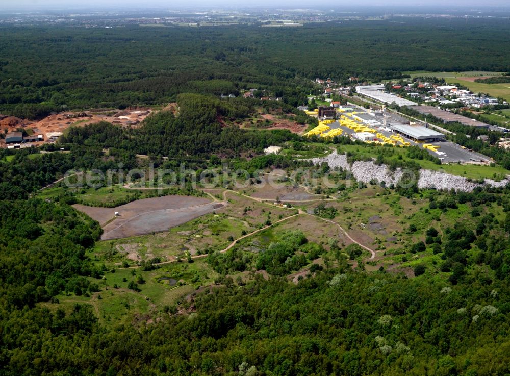 Aerial photograph Messel - The Messel is a disused mine. Was known by the Messel Pit and beautifully preserved fossils found there are of mammals, birds, reptiles, fish, insects and plants from the Eocene. Best known is the early equine Propalaeotherium, were found by more than 70 individuals. Other important findings are Messelornis cristata, a crane bird, about half of all be found in the Messel Pit Fossil bird belongs, and an extinct primate. The Messel Pit is the first of the three UNESCO World Natural Heritage sites in Germany