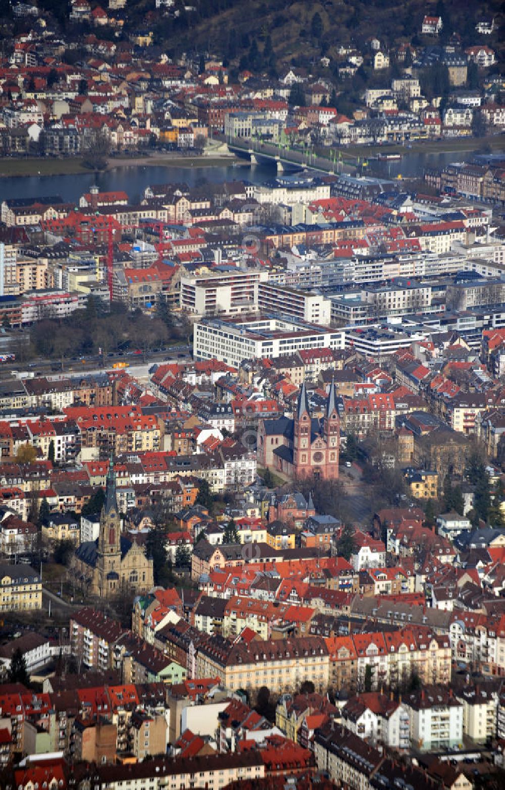 Aerial image Heidelberg - View of the Heidelberg old town district in the foreground and Neuenheim district in the background. The skyline of the old city is strongly branded by the two churches of St. Boniface and the Church of Christ. Both districts are separated by the Neckar river