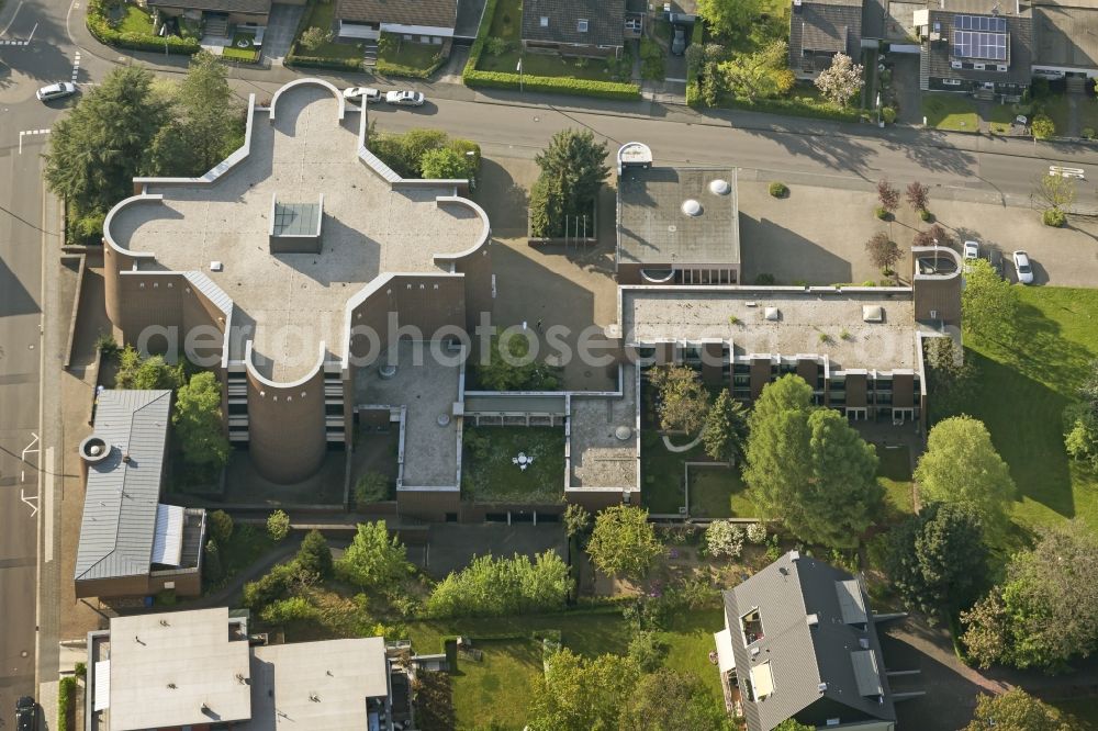 Aerial image Bonn - The Heilig-Kreuz Church (Holy Cross) in the Limperich part of the district of Beuel in Bonn in the state of North Rhine-Westphalia. Church and adjacent monastery were built in the shape of a cross in the 1960s