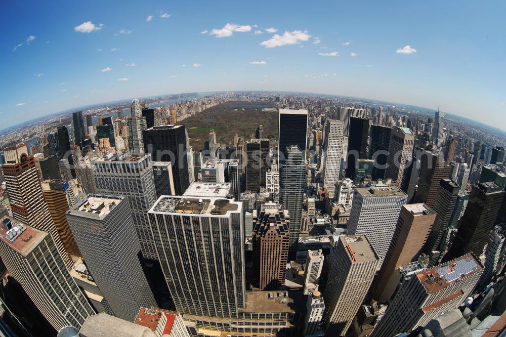 Aerial image New York - Fish-eye view of the skyscrapers of the Midtown Center of Manhattan to New York's Central Park. This park was established in 1853 and is used ever since as a public park