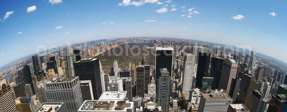 Aerial photograph New York - Fish-eye view of the skyscrapers of the Midtown Center of Manhattan to New York's Central Park. This park was established in 1853 and is used ever since as a public park