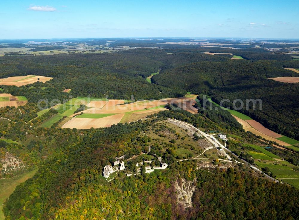 Gössenheim from the bird's eye view: Homburg Castle in the borough of Goessenheim in the state of Bavaria. The ruins of a high fortress from the 11th century is one of the largest ruin compound in Germany. Its decay started in the 17th century. What remains are a tower and parts of the walls and foundations. View from the West to the East