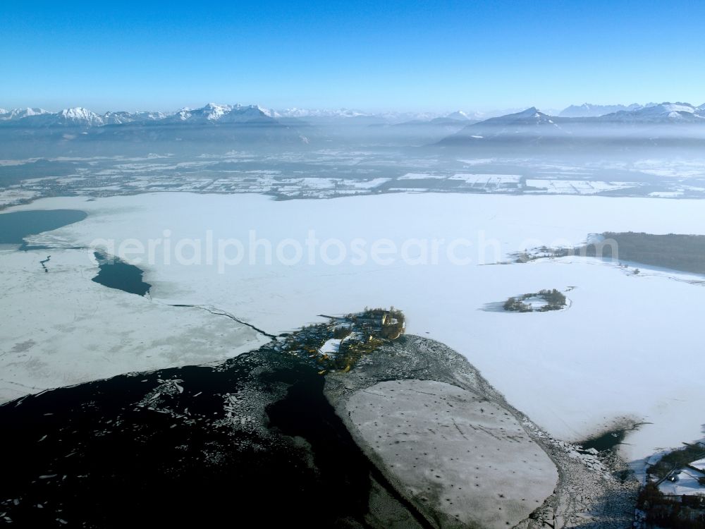 Frauenchiemsee from above - The island Frauenchiemsee in the lake Chiemsee in the state of Bavaria. The island is car free and reachable via ship throughout the year. The island is snow covered and the lake is frozen