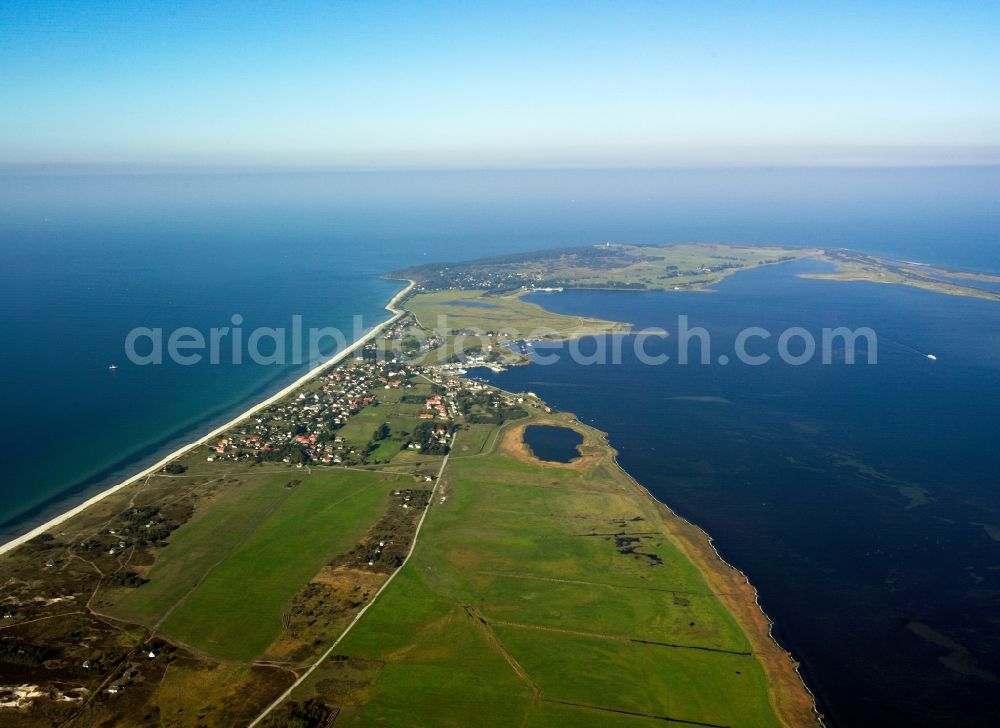 Insel Hiddensee from the bird's eye view: The island is located west of Hiddensee Rügen in the Baltic Sea. It belongs to the district of Pomerania-Rügen in Mecklenburg-Western Pomerania. The Hiddensee includes the island and its eastern offshore island and one from 2005 to the Official West Ruegen. Hiddensee is the largest island of the National Park Boddenlandscape. On the island there are two nature reserves, the NSG Dünenheide between Neuendorf and Vitte and the NSG Dornbusch in the north