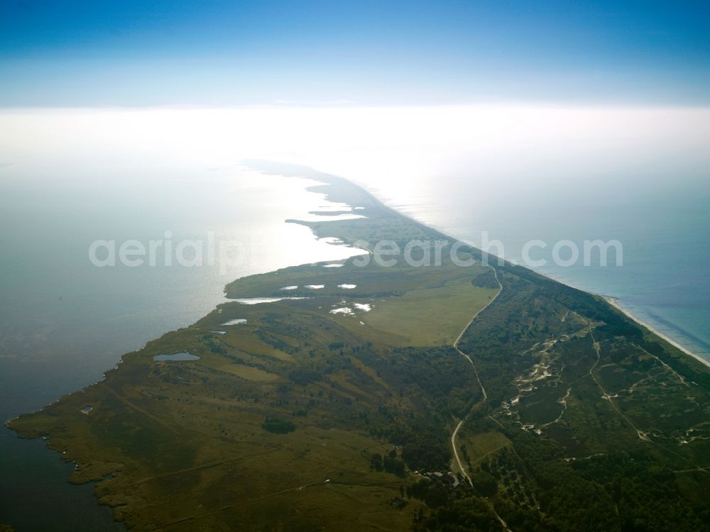 Insel Hiddensee from the bird's eye view: The island is located west of Hiddensee Rügen in the Baltic Sea. It belongs to the district of Pomerania-Rügen in Mecklenburg-Western Pomerania. The Hiddensee includes the island and its eastern offshore island and one from 2005 to the Official West Ruegen. Hiddensee is the largest island of the National Park Boddenlandscape. On the island there are two nature reserves, the NSG Dünenheide between Neuendorf and Vitte and the NSG Dornbusch in the north