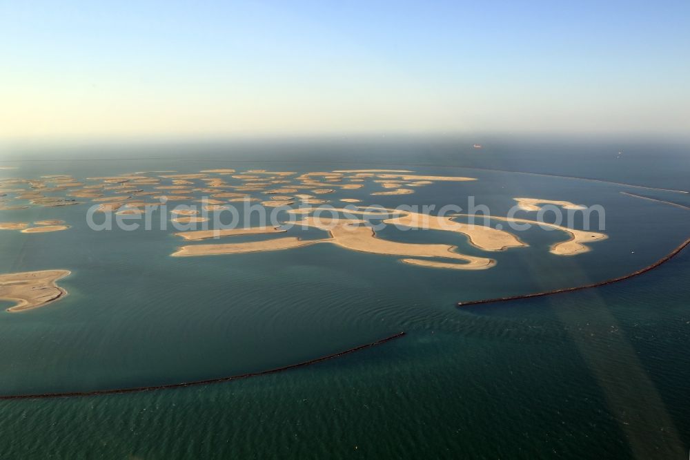 Aerial photograph Dubai - The islands of The World just off the coast of Dubai in the United Arab Emirates consists of about three hundred man-made islands. The giant project threatens to become a flop. Since 2011, the construction works rest. Only two islands are completed and inhabited