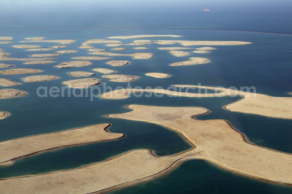 Dubai from the bird's eye view: The islands of The World just off the coast of Dubai in the United Arab Emirates consists of about three hundred man-made islands. The giant project threatens to become a flop. Since 2011, the construction works rest. Only two islands are completed and inhabited