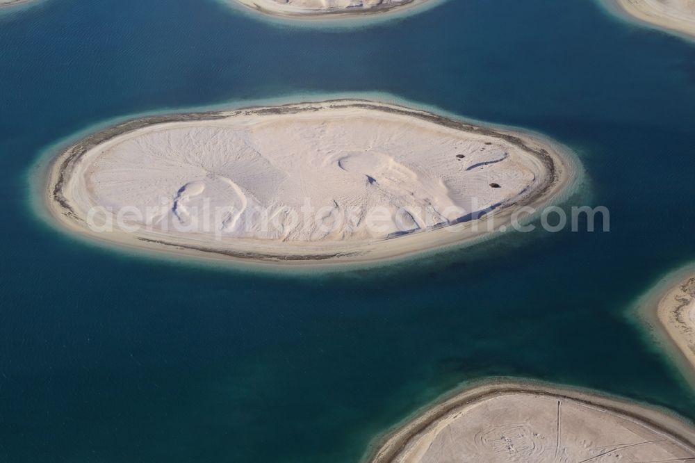 Aerial photograph Dubai - The islands of The World just off the coast of Dubai in the United Arab Emirates consists of about three hundred man-made islands. The giant project threatens to become a flop. Since 2011, the construction works rest. Only two islands are completed and inhabited