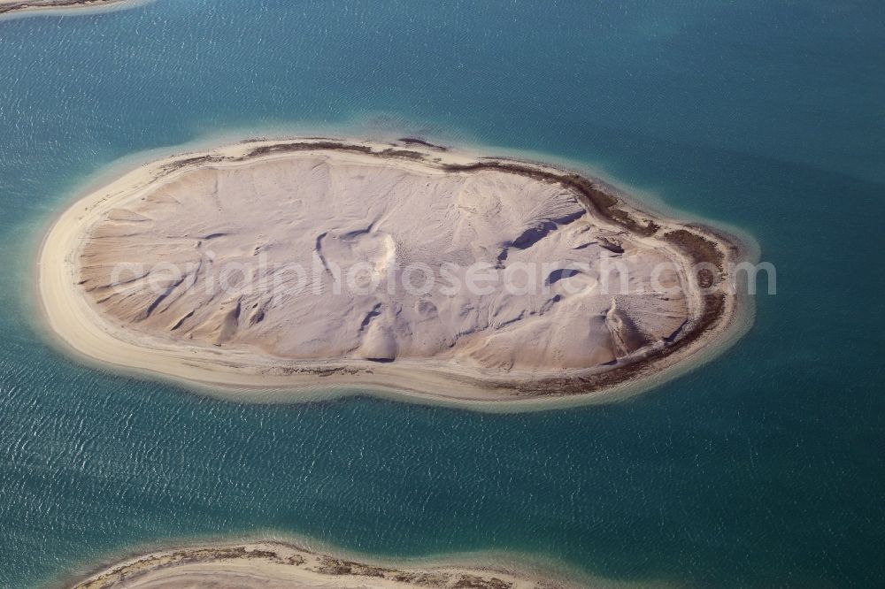 Aerial photograph Dubai - The islands of The World just off the coast of Dubai in the United Arab Emirates consists of about three hundred man-made islands. The giant project threatens to become a flop. Since 2011, the construction works rest. Only two islands are completed and inhabited