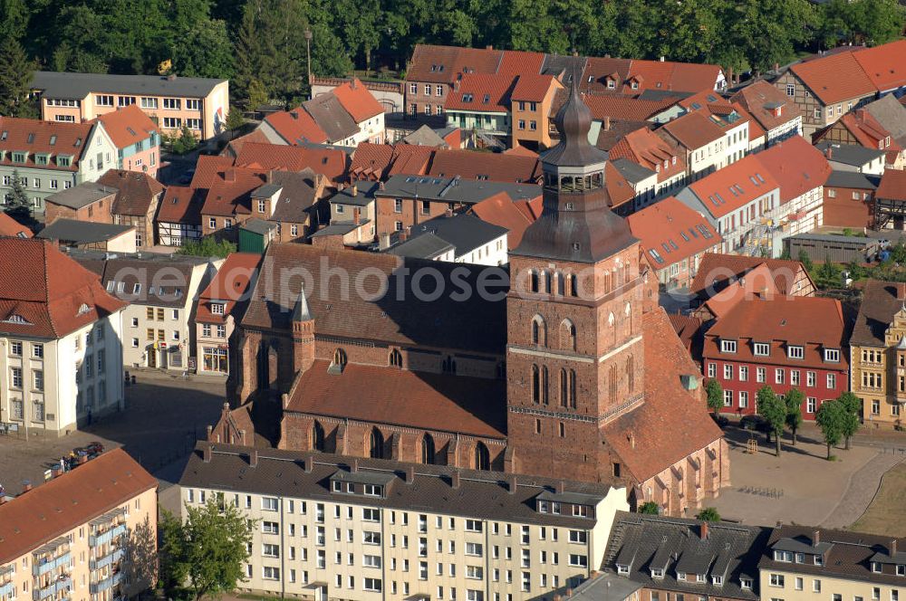 Aerial image Malchin - Blick auf die St. Johanneskirche. Sie wurde im 14. Jahrhundert als Ersatz für den zuvor abgebrannten Erstbau, in der für Norddeutschland typischen Backsteingotik gebaut. Der begehbare Turm ist 67 m hoch und befindet sich in der Nordwestecke des Gebäudes. Die Kirche gehört zur Evangelisch-Lutherischen Landeskirche Mecklenburgs. Kontakt: St. Johanniskirche, Am Markt, 17139 Malchin, Tel. 03994 / 640111