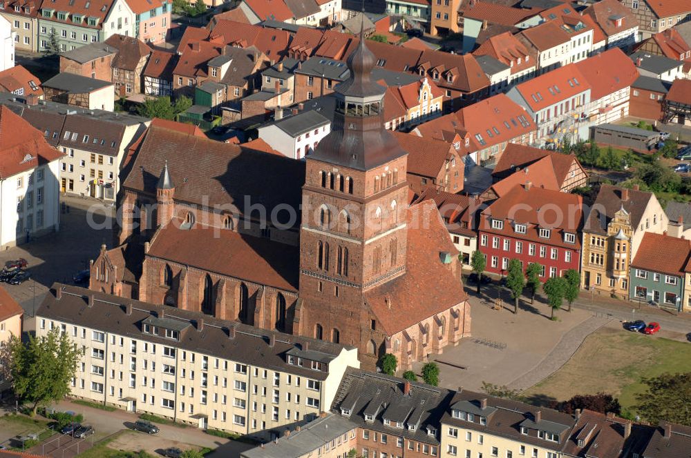 Aerial photograph Malchin - Blick auf die St. Johanneskirche. Sie wurde im 14. Jahrhundert als Ersatz für den zuvor abgebrannten Erstbau, in der für Norddeutschland typischen Backsteingotik gebaut. Der begehbare Turm ist 67 m hoch und befindet sich in der Nordwestecke des Gebäudes. Die Kirche gehört zur Evangelisch-Lutherischen Landeskirche Mecklenburgs. Kontakt: St. Johanniskirche, Am Markt, 17139 Malchin, Tel. 03994 / 640111