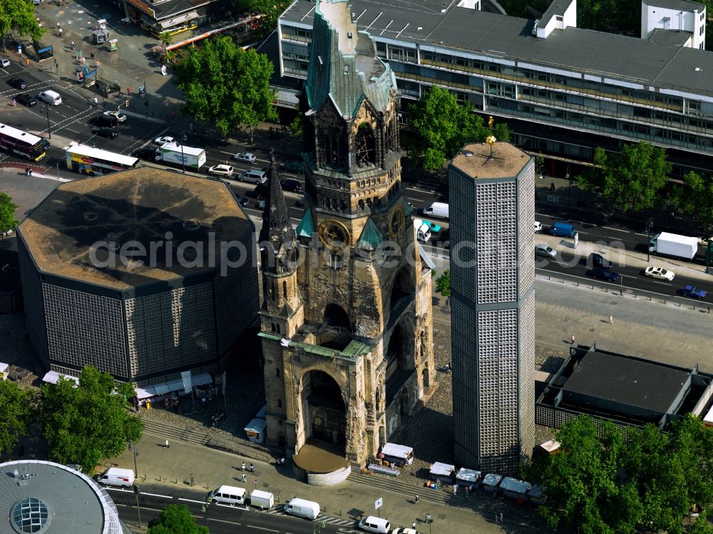 Berlin from above - The Protestant Kaiser William Memorial Church, commonly short memorial church stands on the Breitscheidplatz between the Kurfürstendamm, the Tauentzienstraße and the Budapest street in Berlin's Charlottenburg district. The non-damaged part of the old church is now a museum and war memorial