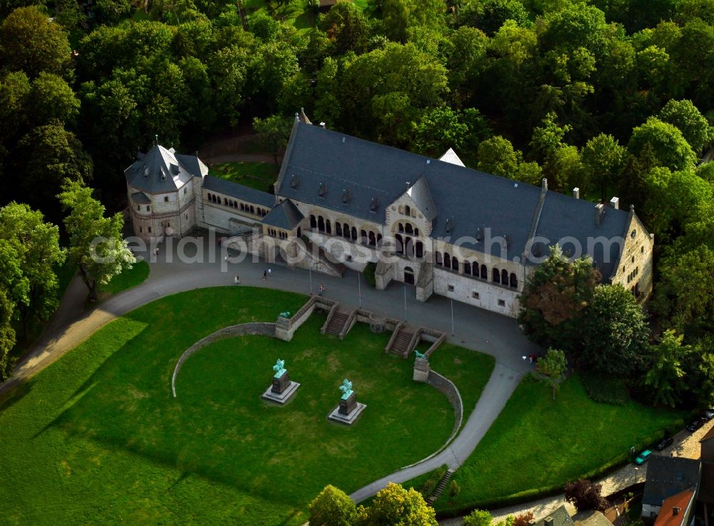 Goslar from the bird's eye view: The Imperial Palace of Goslar at the foot of the Rammelsberg hill in the town of Goslar in the state of Lower Saxony. The compound consists of several buildings like the Kaiserhaus, the old collegiate church of St. Simon and Jude, the palace chapel of St. Ulrich and the Church of Our Lady. The Kaiserhaus is the oldest and greatest secular building in Germany dating back to the 11th century. The site is a UNESCO world heritage site