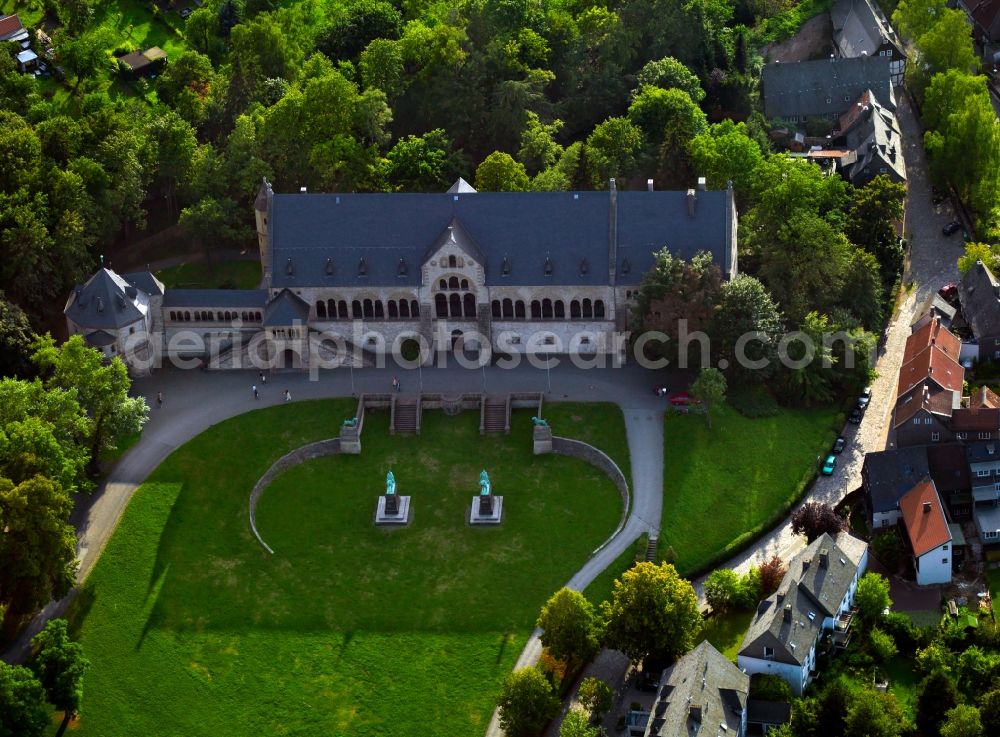 Aerial image Goslar - The Imperial Palace of Goslar at the foot of the Rammelsberg hill in the town of Goslar in the state of Lower Saxony. The compound consists of several buildings like the Kaiserhaus, the old collegiate church of St. Simon and Jude, the palace chapel of St. Ulrich and the Church of Our Lady. The Kaiserhaus is the oldest and greatest secular building in Germany dating back to the 11th century. The site is a UNESCO world heritage site