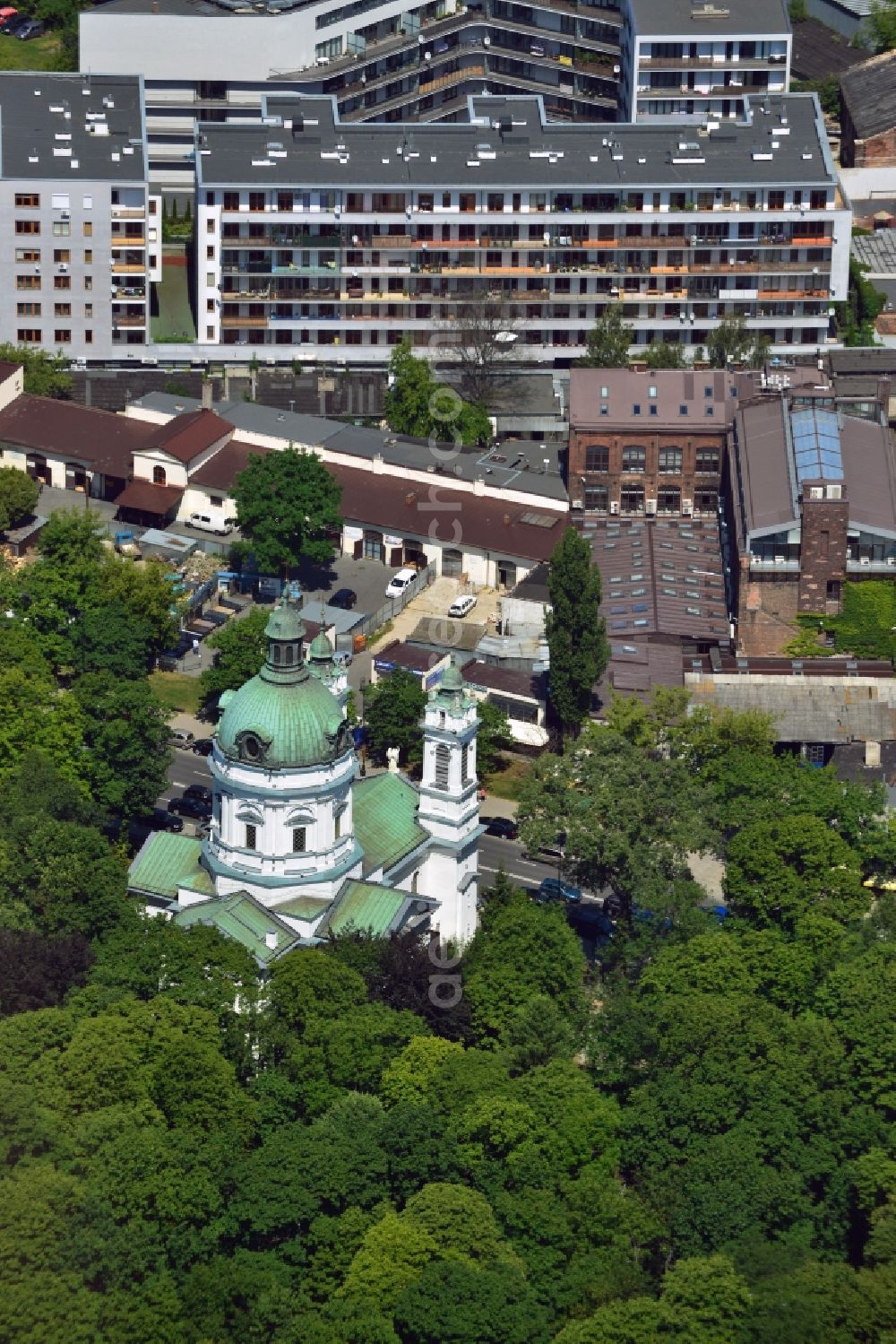 Warschau from the bird's eye view: The Saint Charles Borromäus Church in the Powazki district of Warsaw in Poland. The church (Ko?ció? pw ?wi?tego Karola Boromeusza) was built in th 18th century and refurbished in the 19th century. During the Warsaw Resistance, it was destroyed. It was renovated in 1960 and with its dome and two towers rebuilt. The church is located on the compound of the Powazki cemetery, surrounded by forest and opposite a residential area