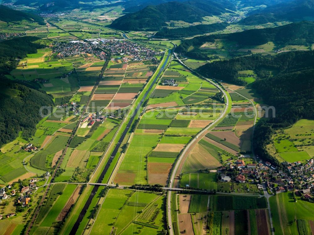 Biberach from above - The river Kinzig in Biberach in the state of Baden-Württemberg. Biberach is a renowned recreational site. The regulated river runs through a valley past Biberach and other towns and counties. The surrounding landscape is informed by fields, agricultures and foothills of the Black Forest