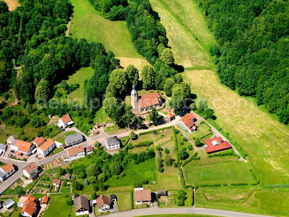 Aerial photograph Labach - The construction of the church is dated to the year 1300. At the beginning of the Reformation the church belonged to the ev.Pfarrei. In the 18th century it was converted into a Catholic church. The church was originally built in the Gothic style