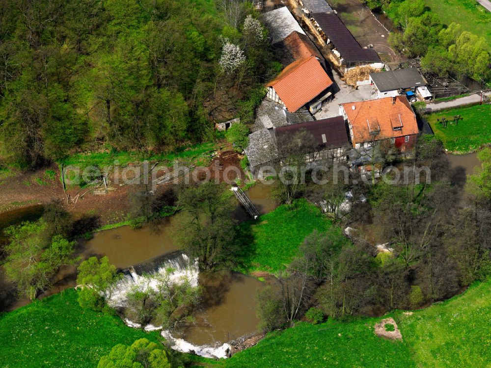 Haunetal from the bird's eye view: Die Klebsmühle ist eine Wassermühle an der Schloßstraße der Ortschaft Rhina in Hessen wird gespeist durch den Fluss Haune. The Blebsmühle is a water mill at Schloß street of the Rhina hamlet. It is fed by the haune river.