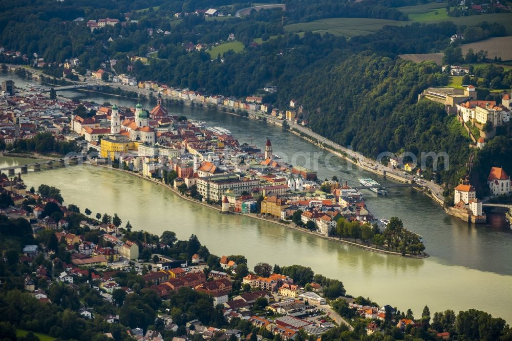 Passau from above - The university town of Passau in the state of Bavaria. Because of the junction of the rivers Ilz, Inn and Danube, Passau is also called Three Rivers Town. Visible here is the pointed peninsula, which is surrounded by the Inn to the South and the Danube to the North. It is the site of the cathedral St. Stephan. The river Ilz joins the other two by running through the Untersolden part of the town
