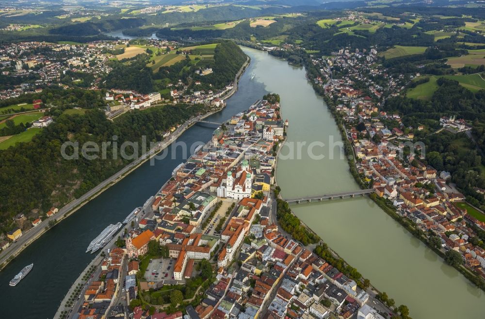 Aerial photograph Passau - The university town of Passau in the state of Bavaria. Because of the junction of the rivers Ilz, Inn and Danube, Passau is also called Three Rivers Town. Visible here is the pointed peninsula, which is surrounded by the Inn to the South and the Danube to the North. It is the site of the cathedral St. Stephan. The river Ilz joins the other two by running through the Untersolden part of the town