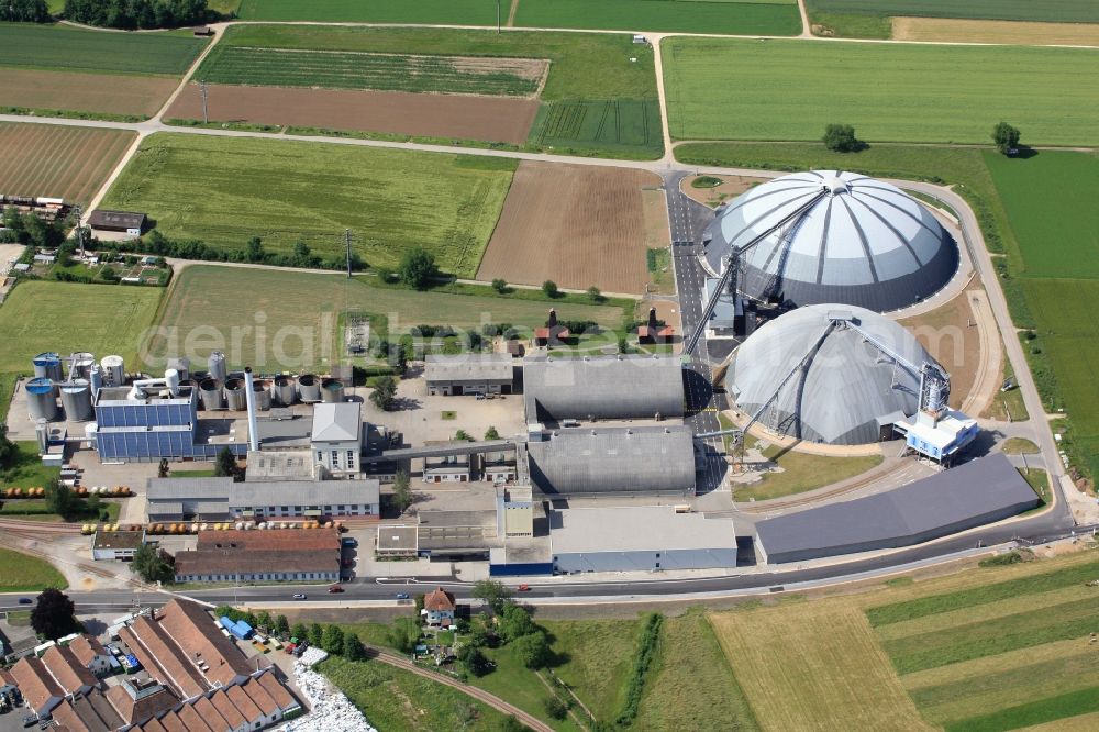 Aerial photograph Rheinfelden - The domes and the operating area of the United Swiss Saltworks in Rheinfelden in Switzerland. The domes are built as a wooden structure and the larger is the largest domed structure in Europe. The circular arenas serve as a salt deposit for de-icing salt for winter maintenance. Built from wood technology company Haering 