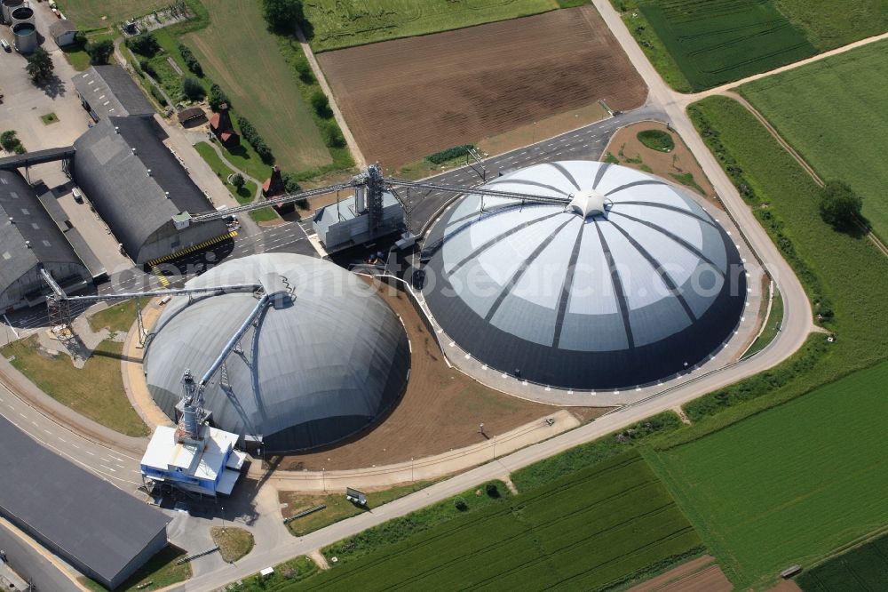 Rheinfelden from the bird's eye view: The domes and the operating area of the United Swiss Saltworks in Rheinfelden in Switzerland. The domes are built as a wooden structure and the larger is the largest domed structure in Europe. The circular arenas serve as a salt deposit for de-icing salt for winter maintenance. Built from wood technology company Haering 