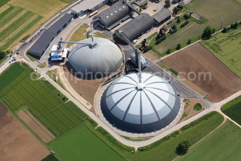 Aerial image Rheinfelden - The domes and the operating area of the United Swiss Saltworks in Rheinfelden in Switzerland. The domes are built as a wooden structure and the larger is the largest domed structure in Europe. The circular arenas serve as a salt deposit for de-icing salt for winter maintenance. Built from wood technology company Haering 