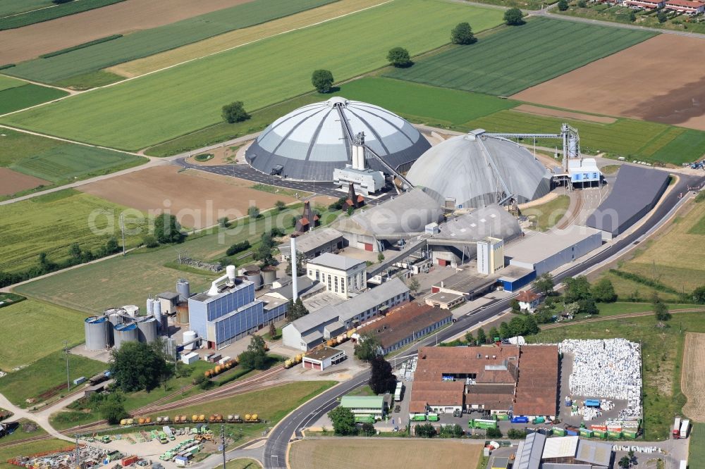 Rheinfelden from above - The domes and the operating area of the United Swiss Saltworks in Rheinfelden in Switzerland. The domes are built as a wooden structure and the larger is the largest domed structure in Europe. The circular arenas serve as a salt deposit for de-icing salt for winter maintenance. Built from wood technology company Haering