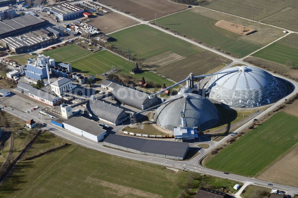 Möhlin from the bird's eye view: The domes and the operating area of the United Swiss Saltworks in Rheinfelden in Switzerland. The domes are built as a wooden structure and the larger is the largest domed structure in Europe. The circular arenas serve as a salt deposit for de-icing salt for winter maintenance. Built from wood technology company Haering