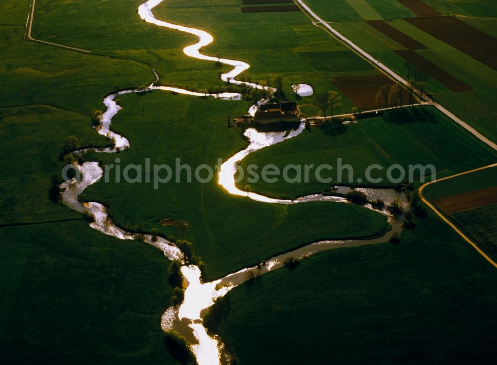 Ansbach from the bird's eye view: The landscape of Ansbach in the state of Bavaria. The landscape is formed by agriculture, fields, small creeks and greens. A small river, where a small mill is located, runs through it here