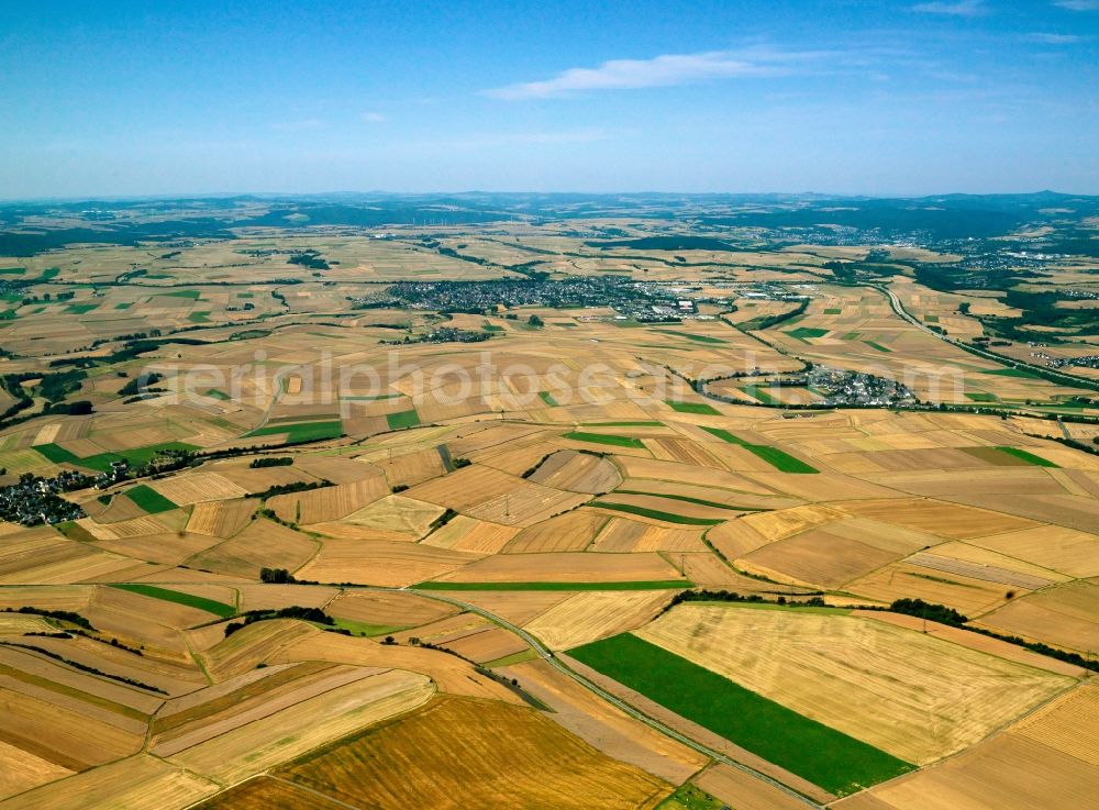 Polch from above - The landscape and fields around Polch in the state of Rhineland-Palatinate. View from Lonnig towards the town of Polch. The motorway (Autobahn) A48 runs in the North of the town. The whole region is characterised by agricultural areas and fields