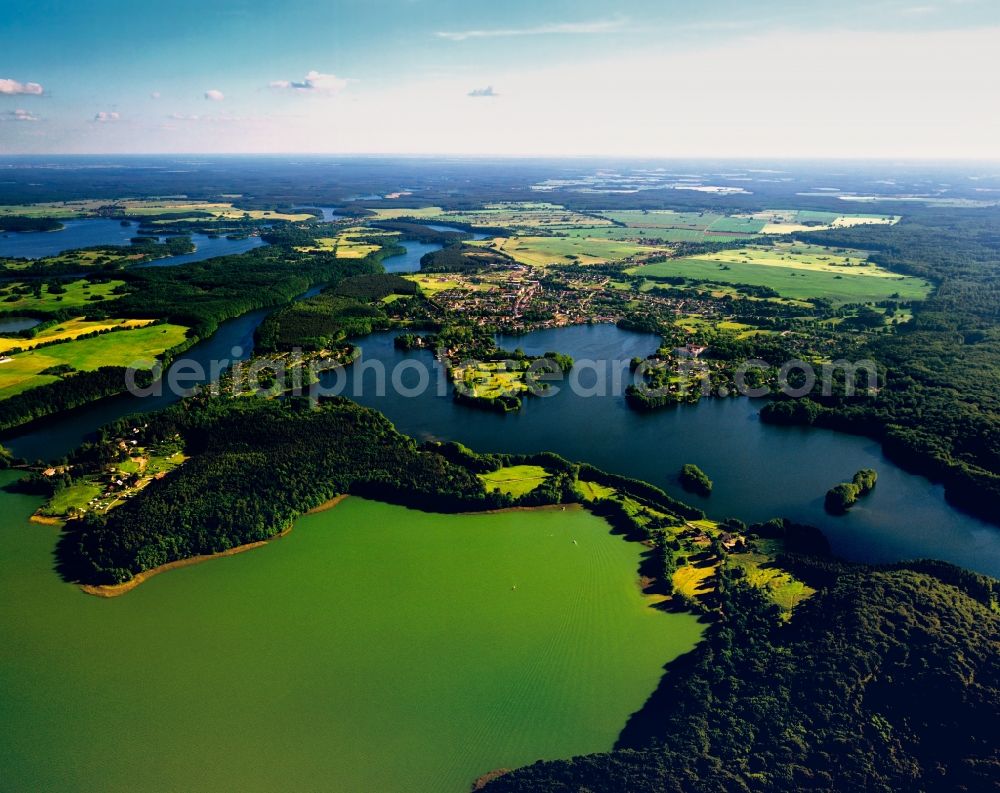 Feldberger Seenlandschaft from the bird's eye view: The landscape of the borough of Feldberger Lake District in the state of Mecklenburg-Vorpommern. It is the largest borough of the state and is home to several lakes, ponds and creeks. The borough is also part of the Nature park and the National Park Mueritz. The panorama shows the view from west to east