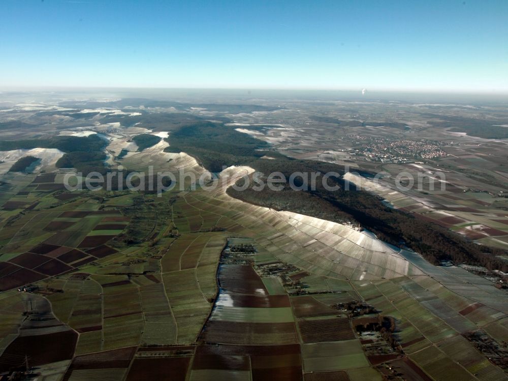 Heilbronn from the bird's eye view: The landscape of Heilbronn in the state of Baden-Württemberg. The different fields of the county and surrounding the city are visible. In the background lies the industrial area of the city, marked by smoke coming from the local heating plant. The river Neckar runs through the envirounment as well